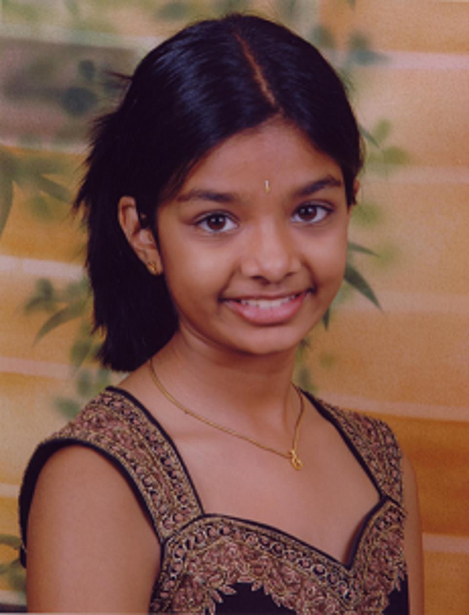 A young Amiti has her photo taken.
