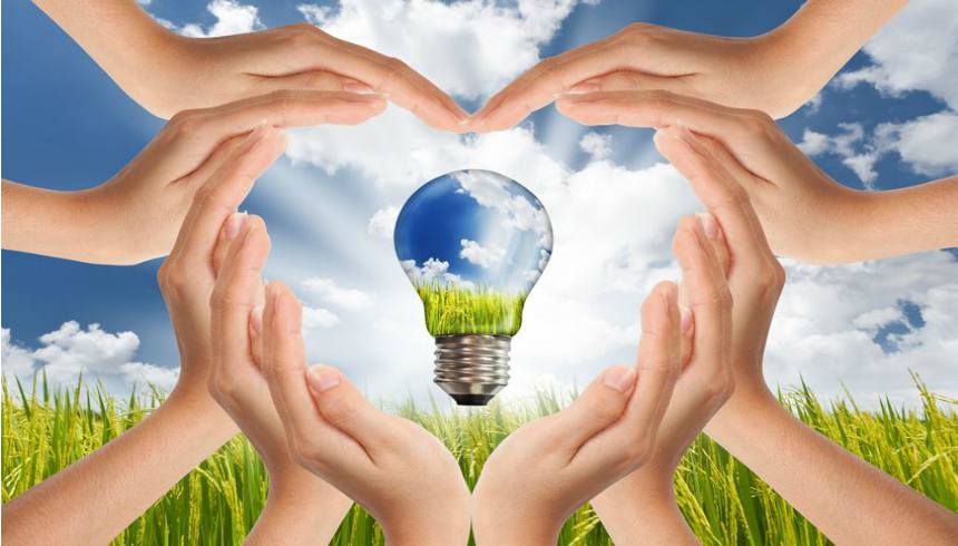 10706793 M Hands Saving Global Concept Of Green Energy Solutions With Light Bulb And Planet On Bright Landscape 123rf.jpg