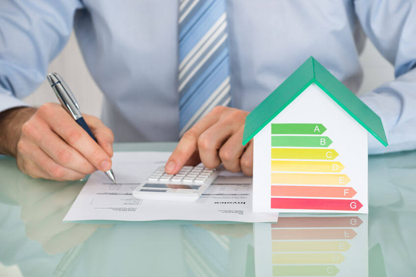 51924965 Close Up Of Businessman Calculating Energy Efficiency Rate Of House In Office 123rf.jpg