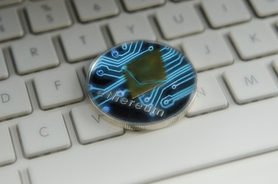 A physical representation of ether, a digital currency, on a keyboard. 